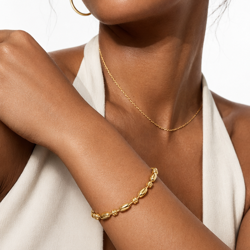 HACKNEY NINE Jewellery ADIATA Gold polished oval bead bracelet with sculpted design, elegant statement jewelry piece.