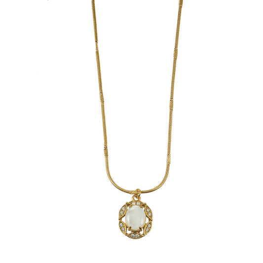 HACKNEY NINE Mythic Gold freshwater pearl halo pendant necklace featuring heirloom-inspired design and intricate gold detailing.