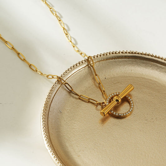 HACKNEY NINE Jewellery Sadika Gold modern pavé zirconia halo toggle necklace with sparkling stones on a delicate chain.