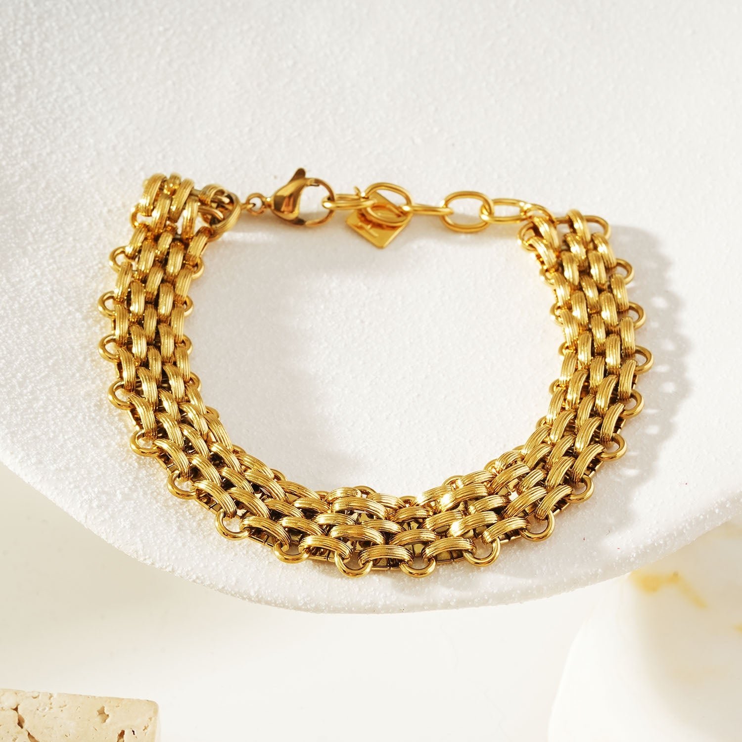HACKNEY NINE Jewellery Carpi Gold vintage woven textured statement bracelet on display.