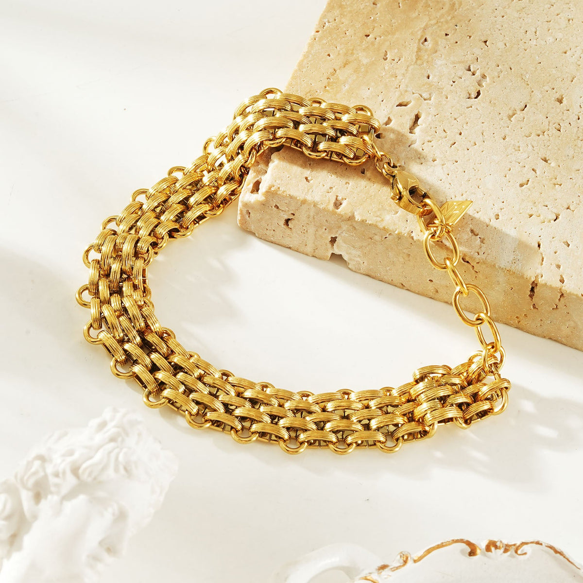 HACKNEY NINE Jewellery Carpi Gold vintage woven textured statement bracelet showing intricate gold-tone design.