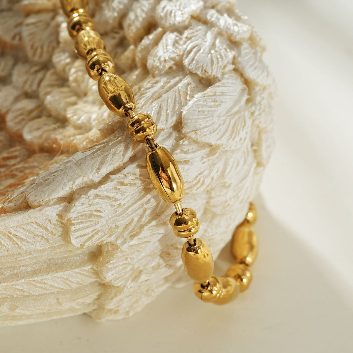 HACKNEY NINE Jewellery ADIATA Gold oval bead bracelet with polished sculpted design, stylish statement jewelry for women.