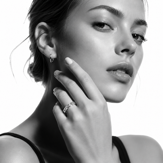 Silver cross over weave pattern band ring by Hackney Nine Jewellery, featuring a sleek, polished white gold finish.