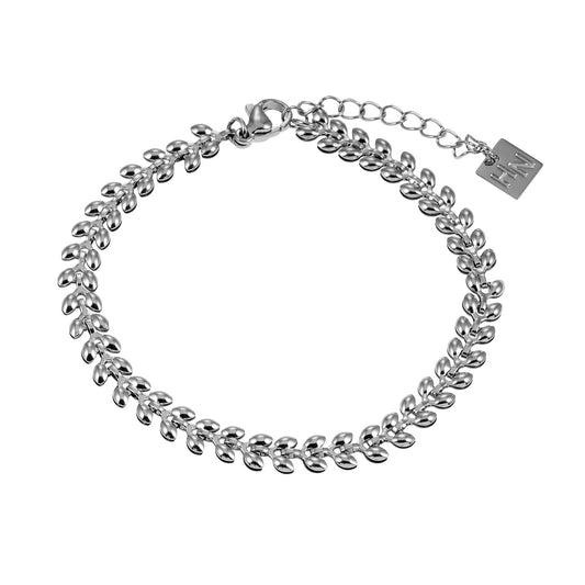 HACKNEY NINE Silver leaf-patterned bold bracelet with white gold finish, featuring intricate leafy design and sturdy band.