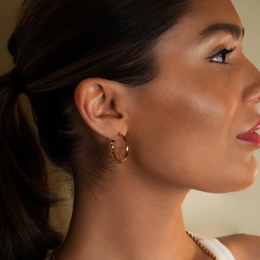 HACKNEY NINE Jewellery YOSHIKO Gold mid-width hoop earrings in 4cm size, showcasing shiny gold finish and classic hoop style.
